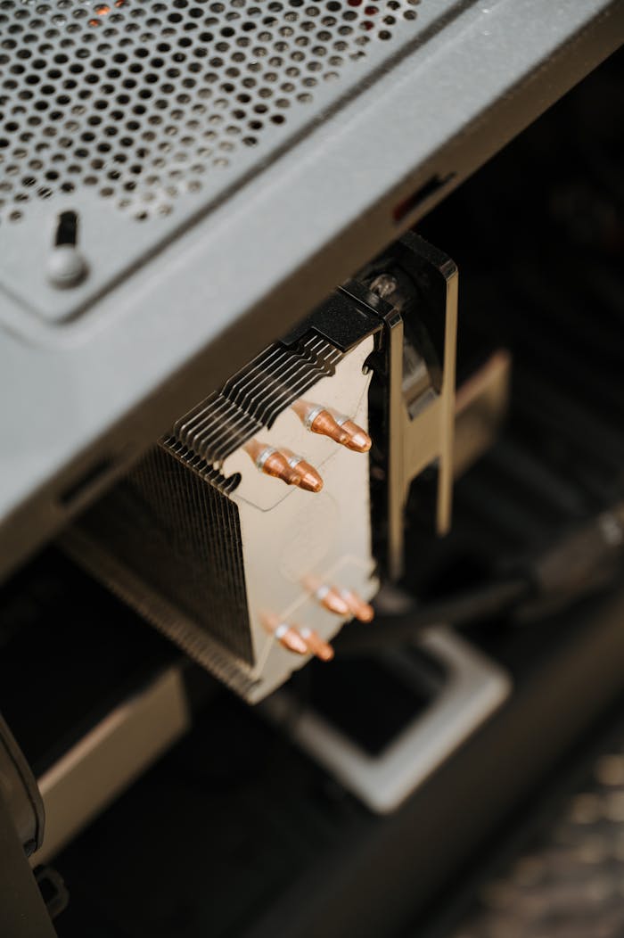 Detailed view of a computer's cooling components and heatsinks inside a desktop case.